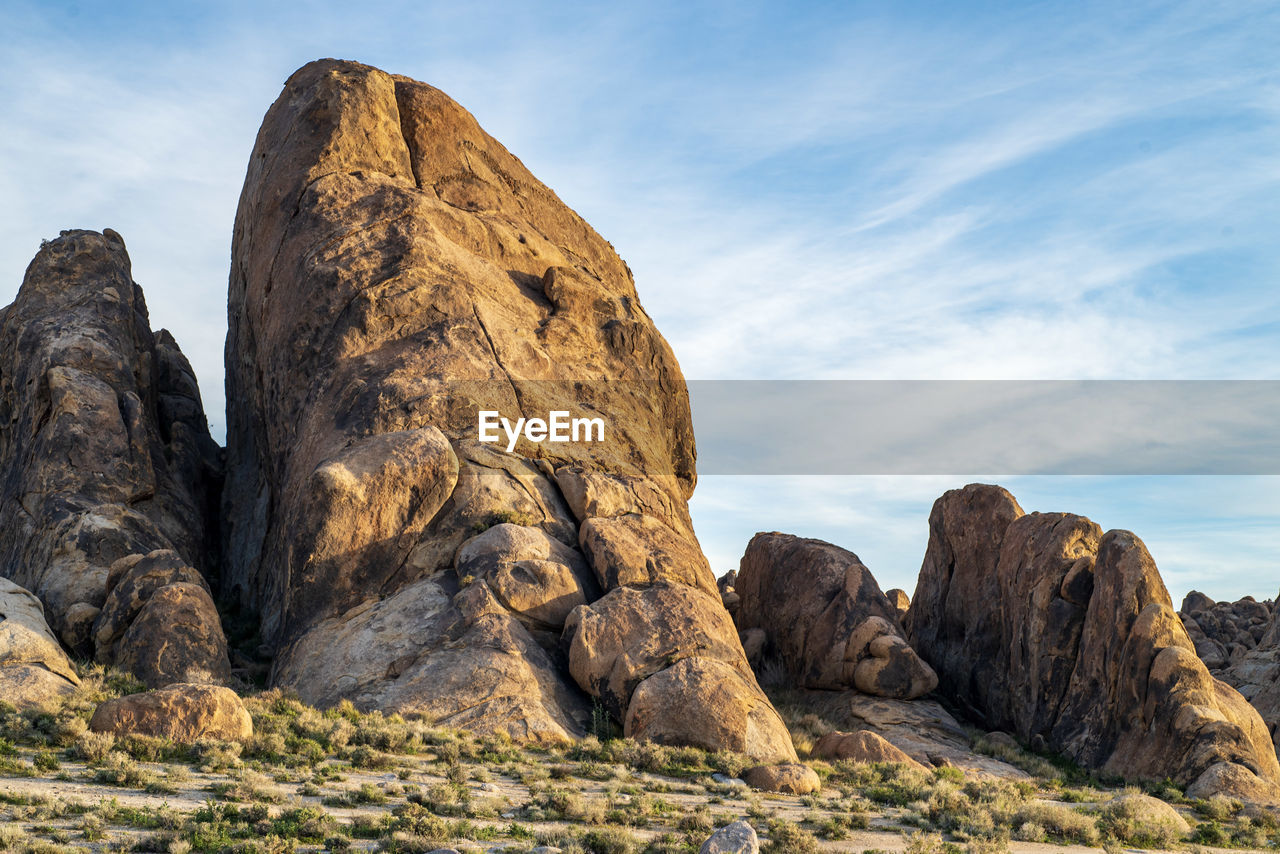 Low angle view of rock formation against sky