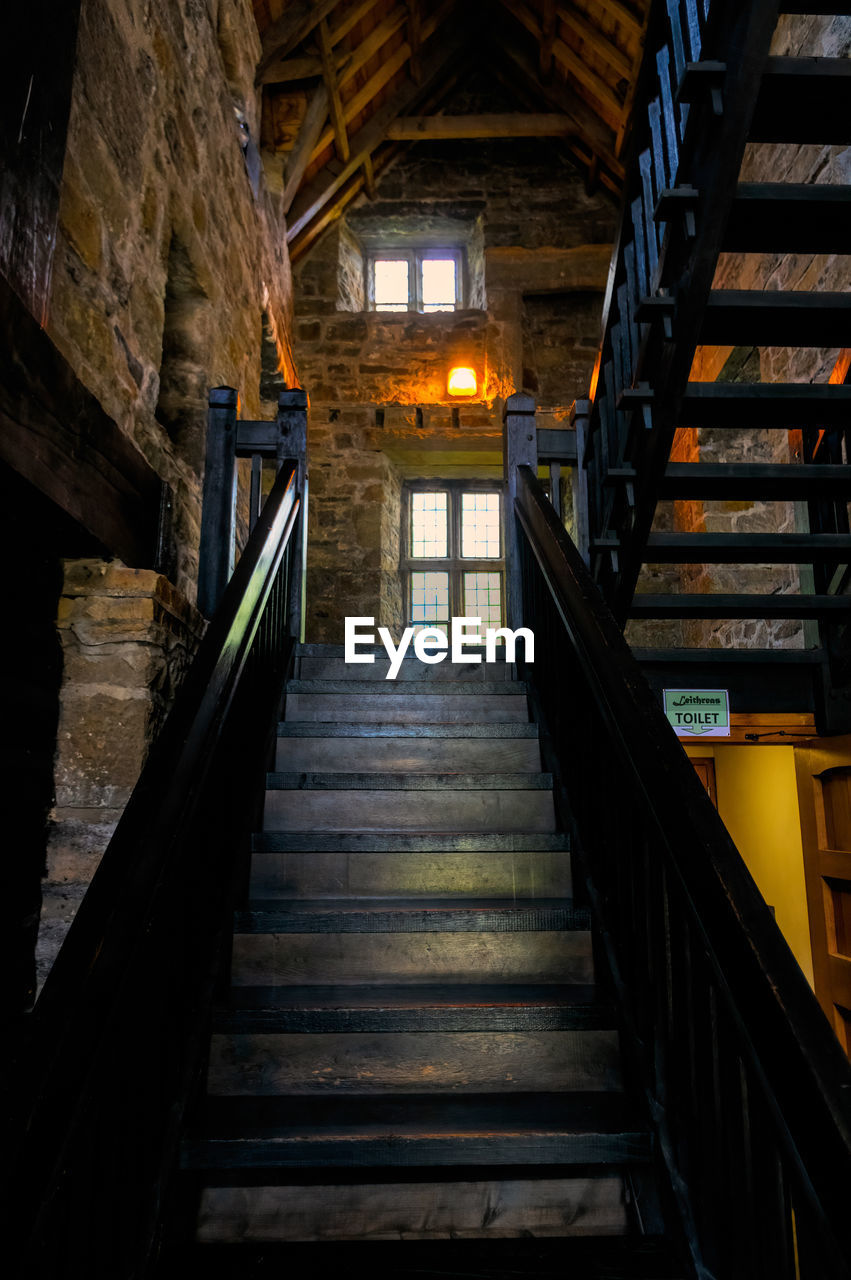 STAIRCASE IN ILLUMINATED BUILDING