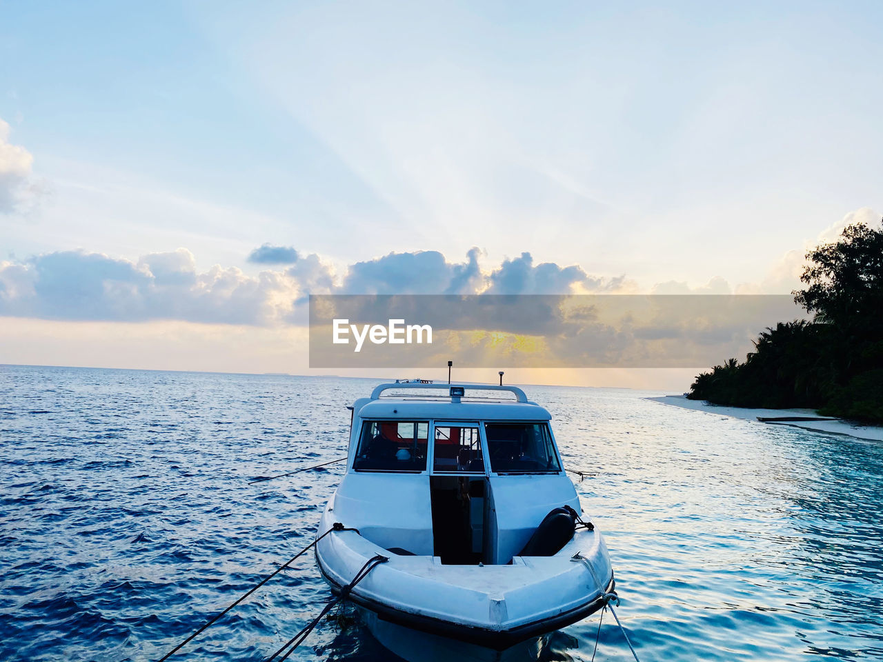 Boat sailing in sea against sky