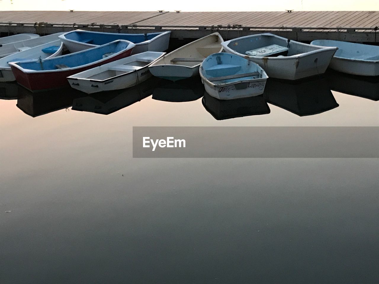 BOATS MOORED AGAINST CLEAR SKY