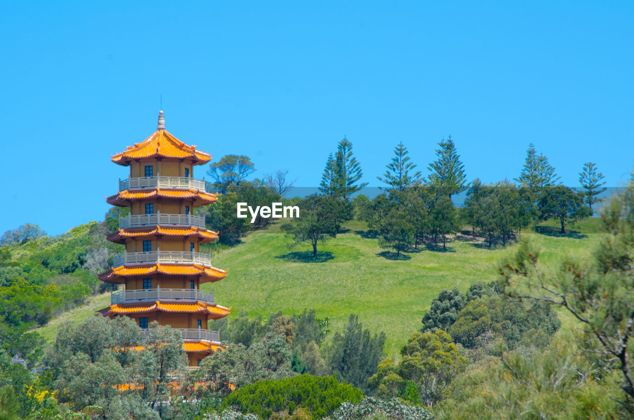 TRADITIONAL TEMPLE AGAINST CLEAR BLUE SKY