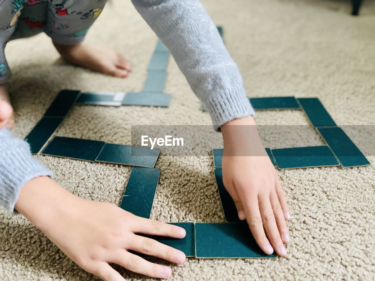 Low section of people on carpet