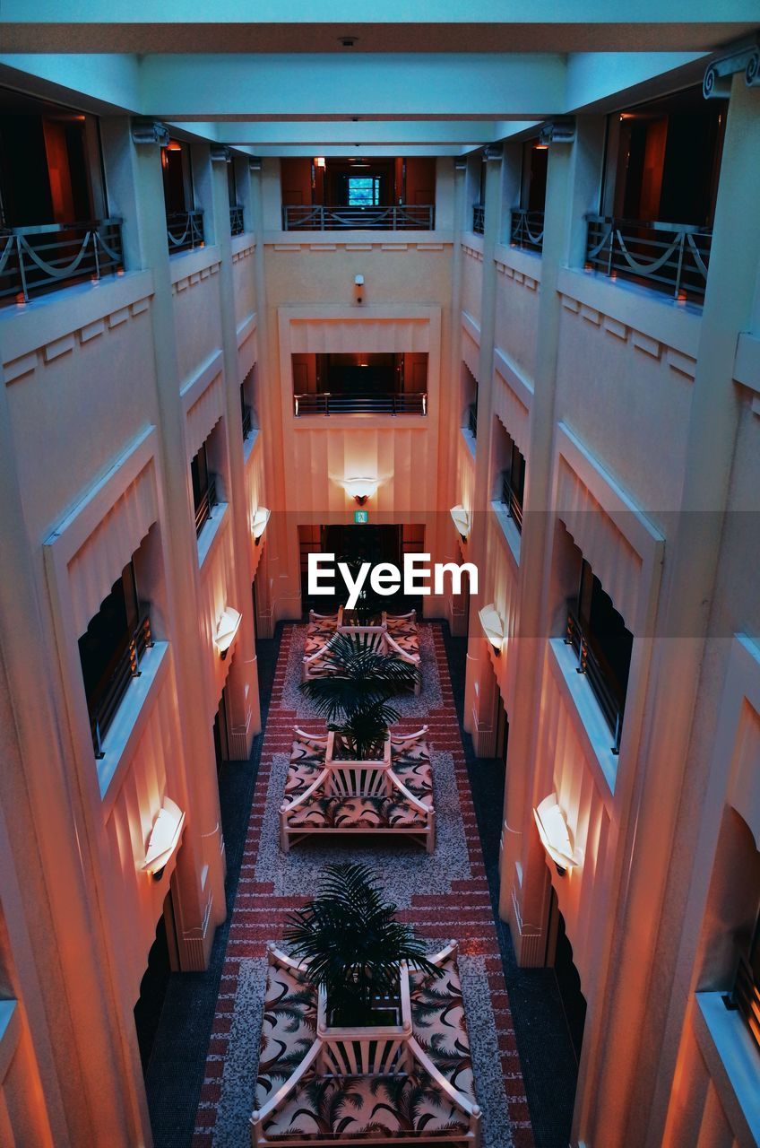 HIGH ANGLE VIEW OF ILLUMINATED BUILDINGS IN BALCONY