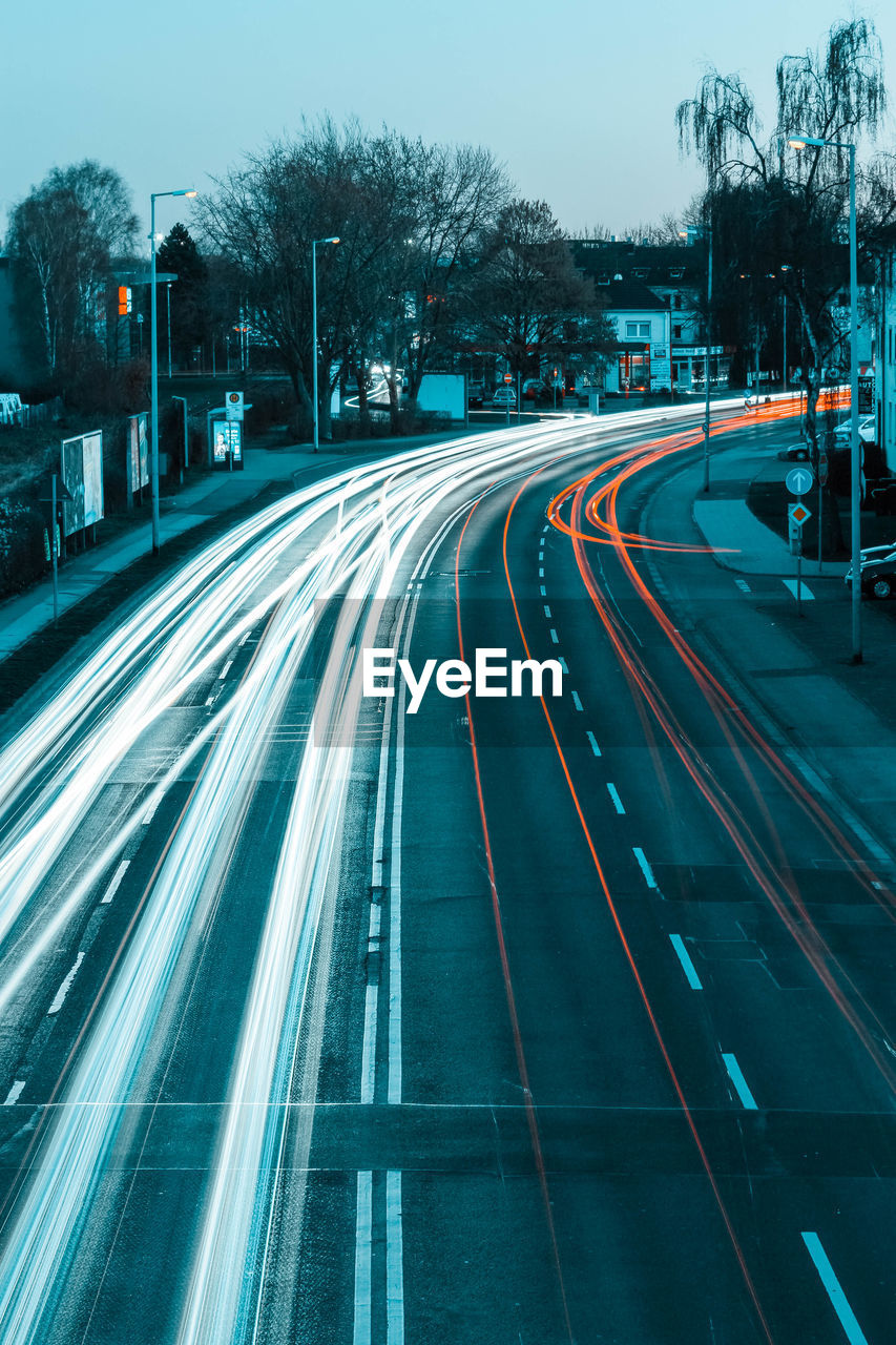 High angle view of light trails on road in city