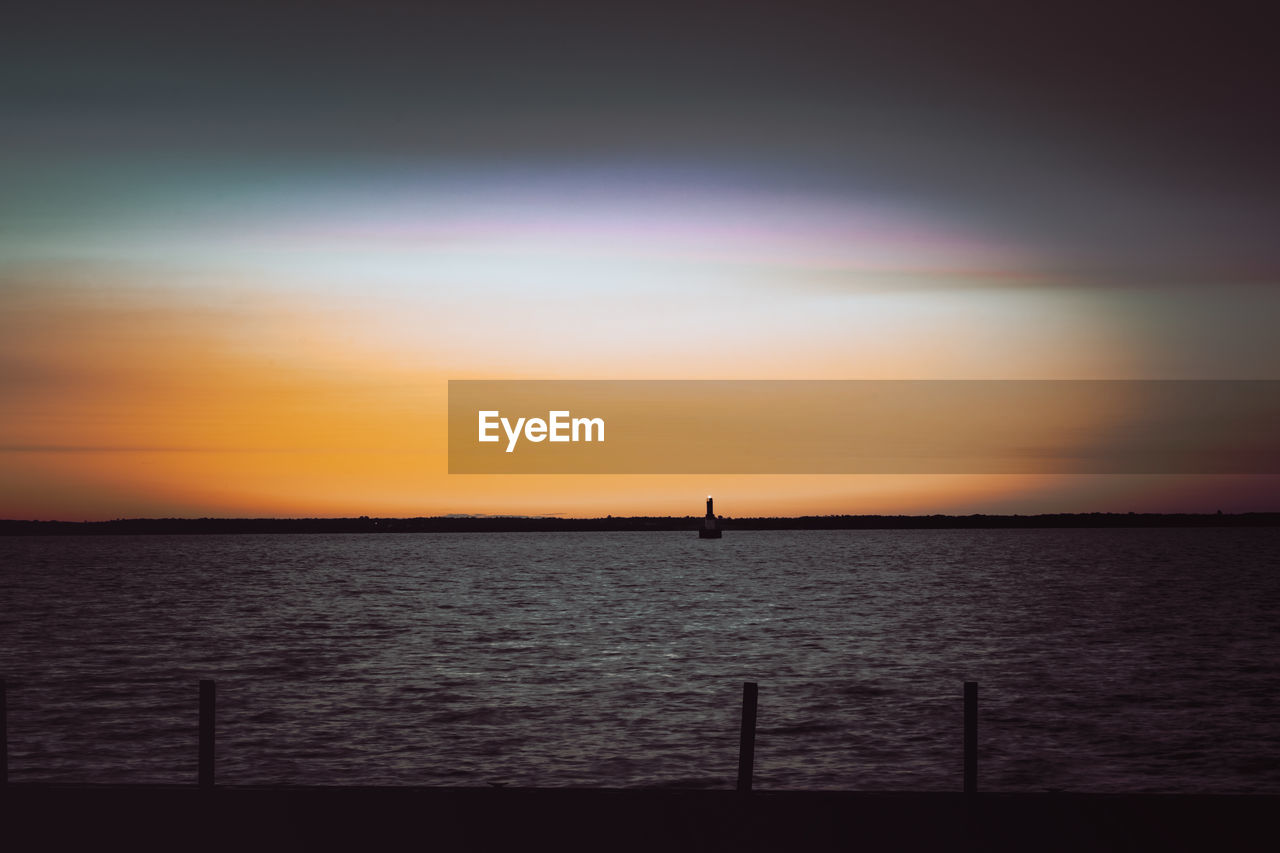 sky, water, sea, sunset, scenics - nature, beauty in nature, horizon, tranquility, tranquil scene, nature, horizon over water, dawn, silhouette, afterglow, ocean, idyllic, cloud, evening, orange color, no people, outdoors, sunlight, non-urban scene, reflection, dramatic sky, wave, sun