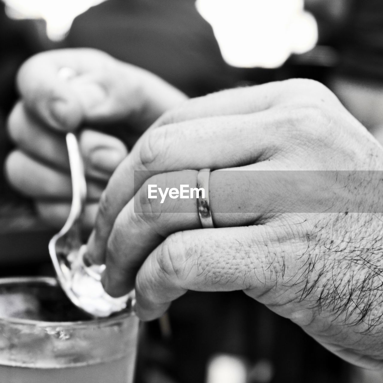 Close-up of man hand holding spoon