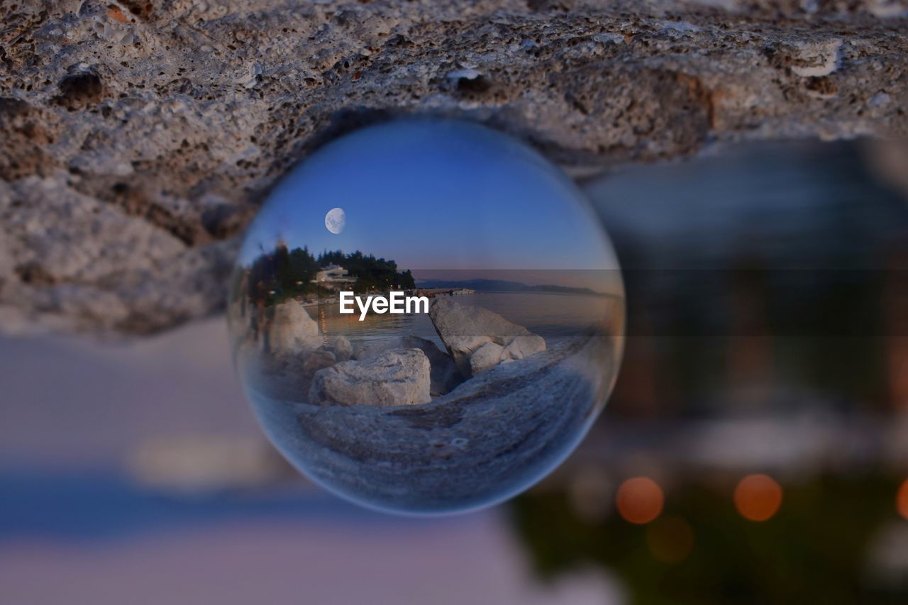 Close-up of crystal ball on water