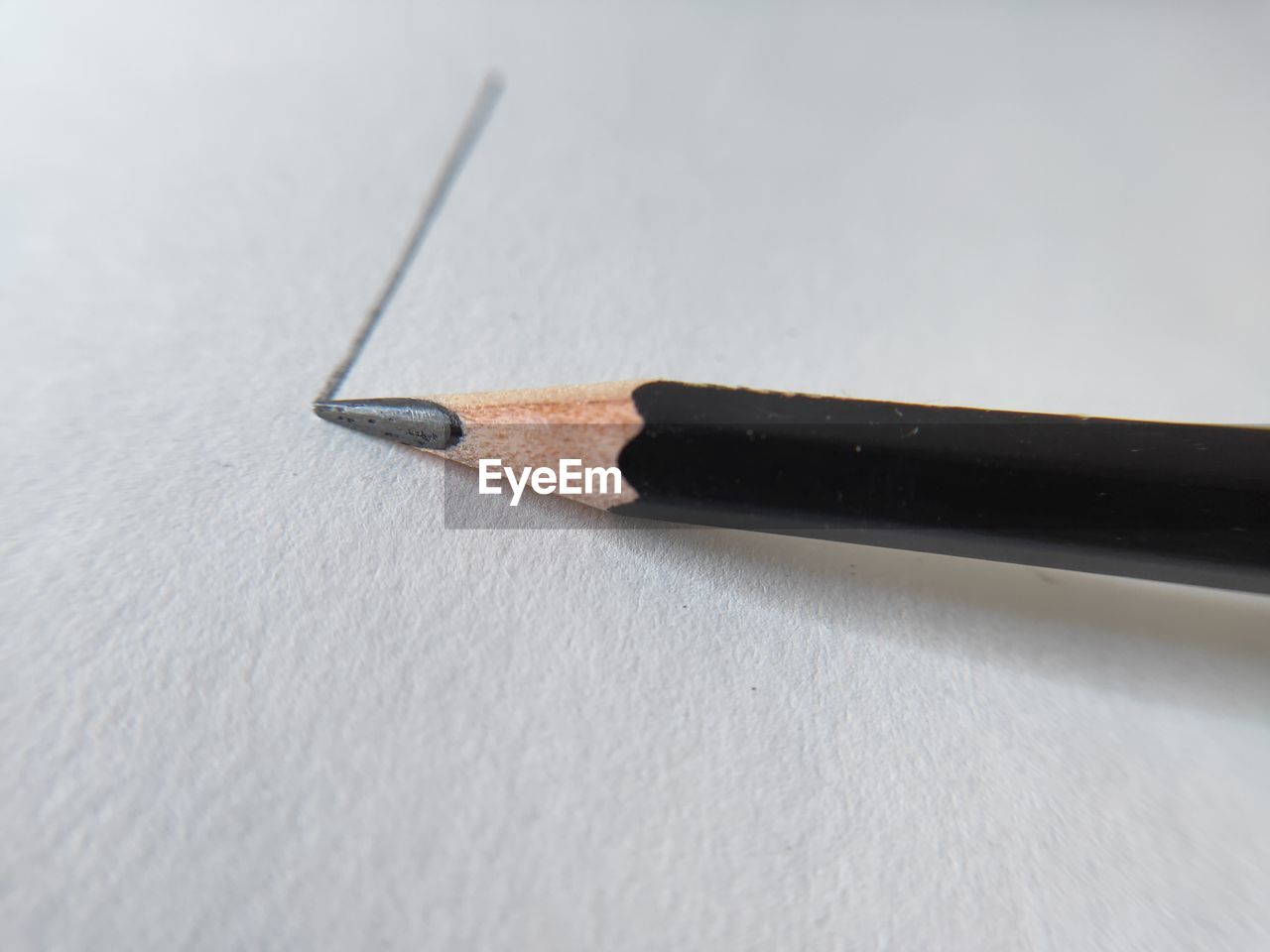 CLOSE-UP OF PENCIL ON TABLE