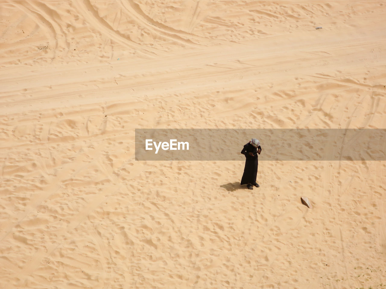 Man standing on sand at beach