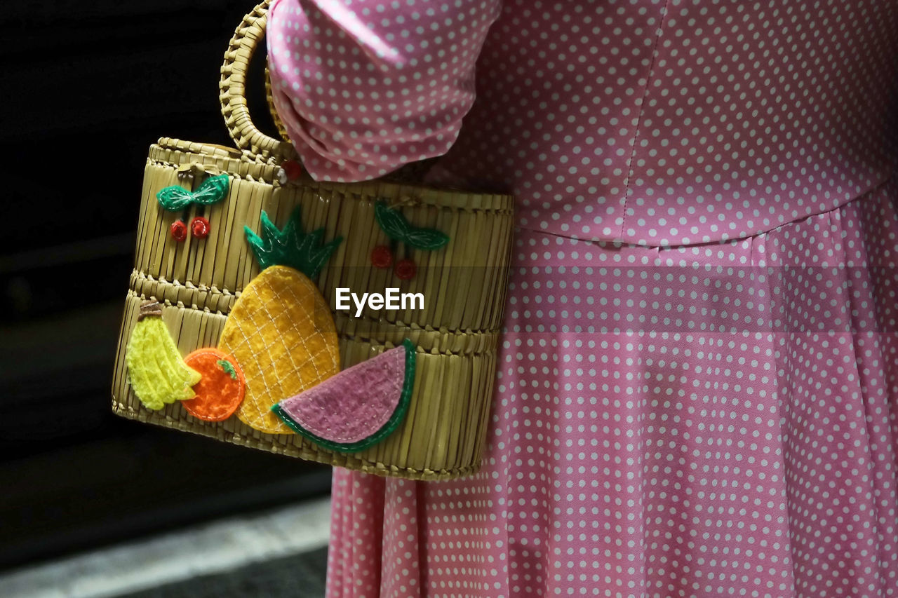 Close-up of summer dress and summer bag