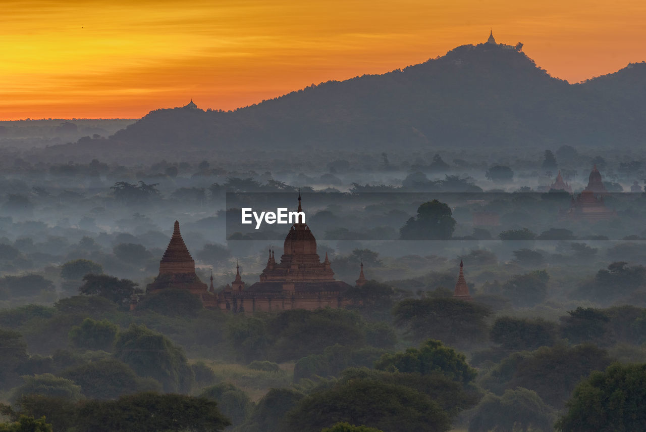 PANORAMIC VIEW OF TEMPLE AGAINST BUILDINGS