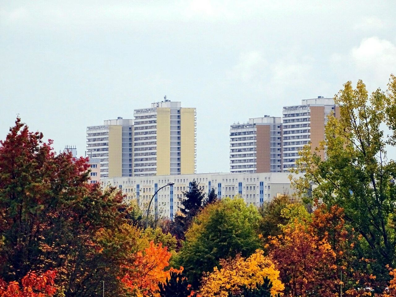 City buildings against cloudy sky