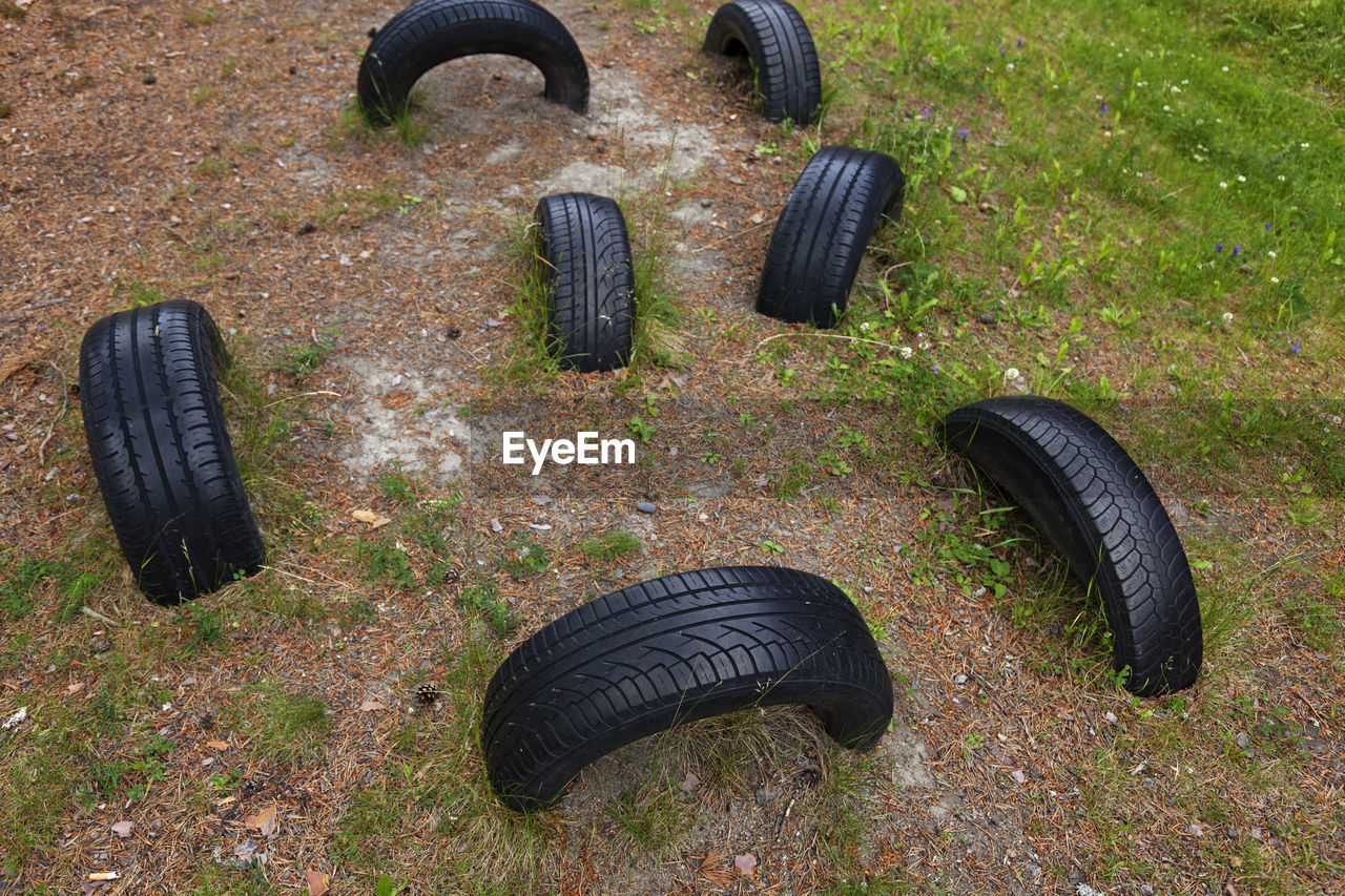 Tires buried in the ground to the obstacle course