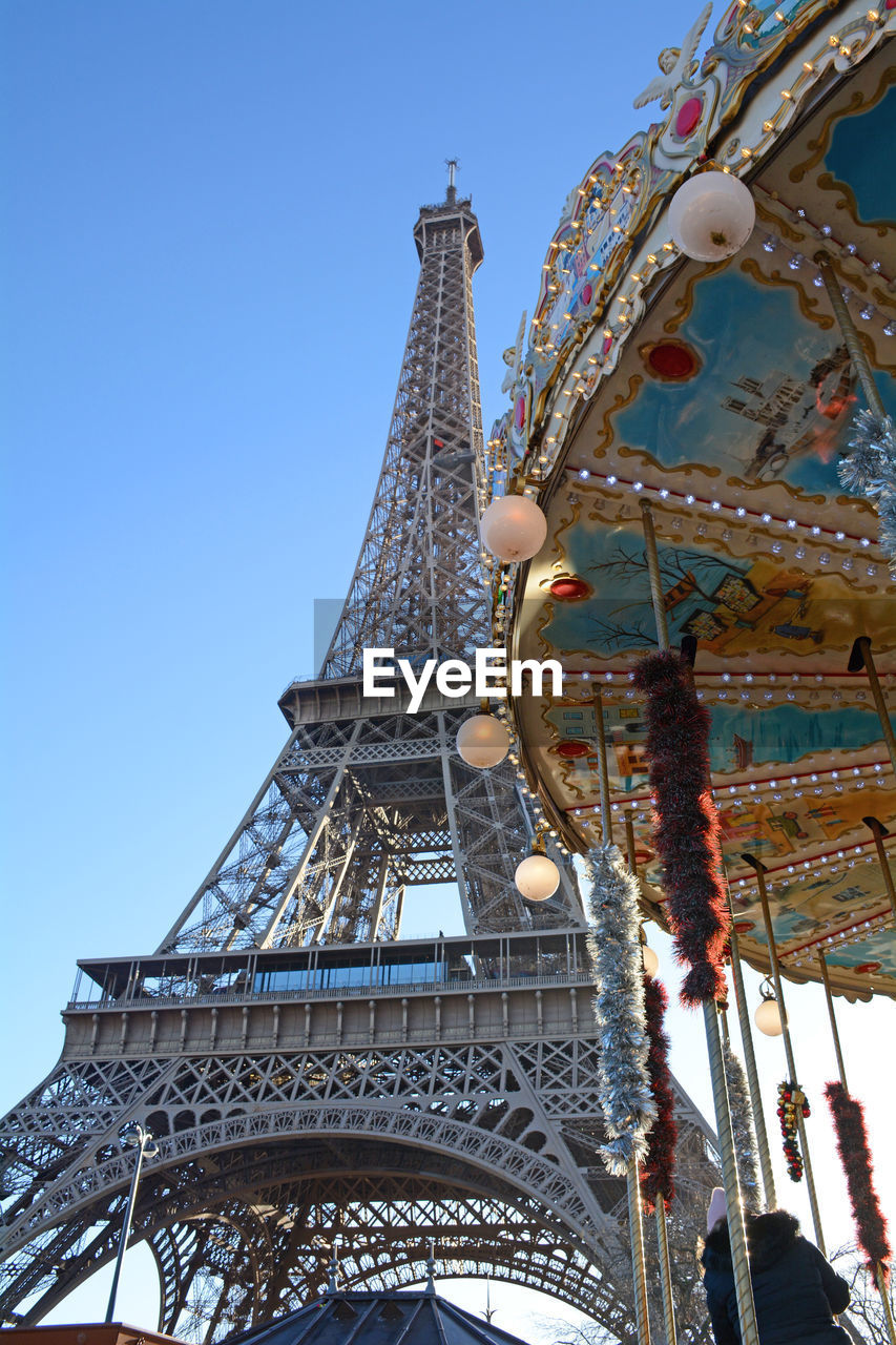 Low angle view of ferris wheel against sky