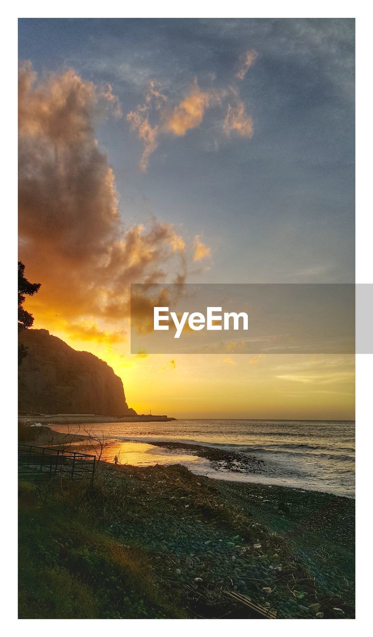 VIEW OF BEACH AT SUNSET