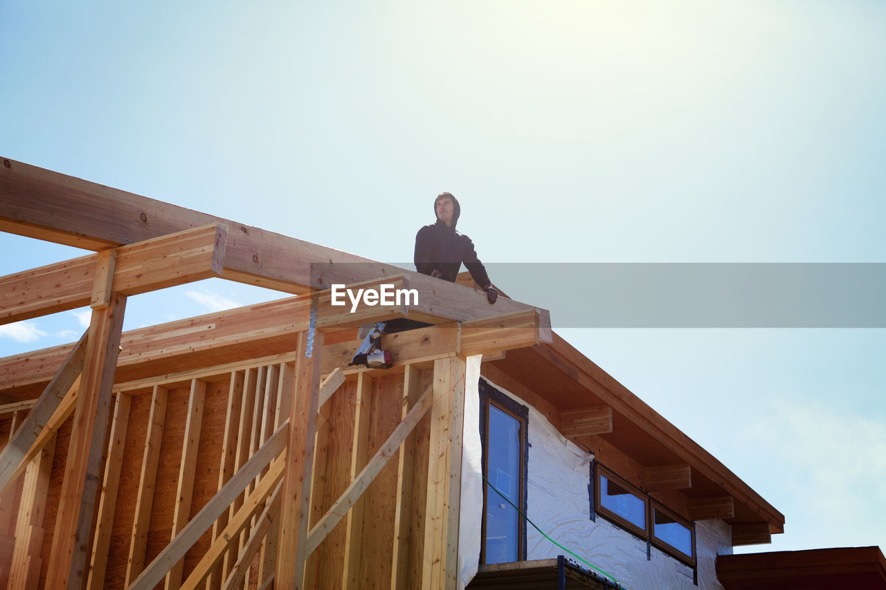 Low angle view of architecture building house against clear sky during sunny day