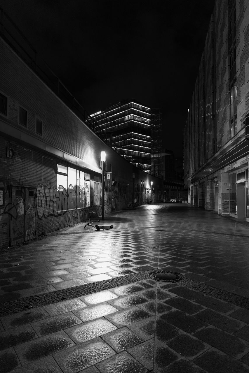 darkness, architecture, night, built structure, black and white, black, building exterior, monochrome, light, urban area, city, monochrome photography, street, white, building, illuminated, road, no people, infrastructure, outdoors, transportation, nature, city life, footpath, the way forward, lighting