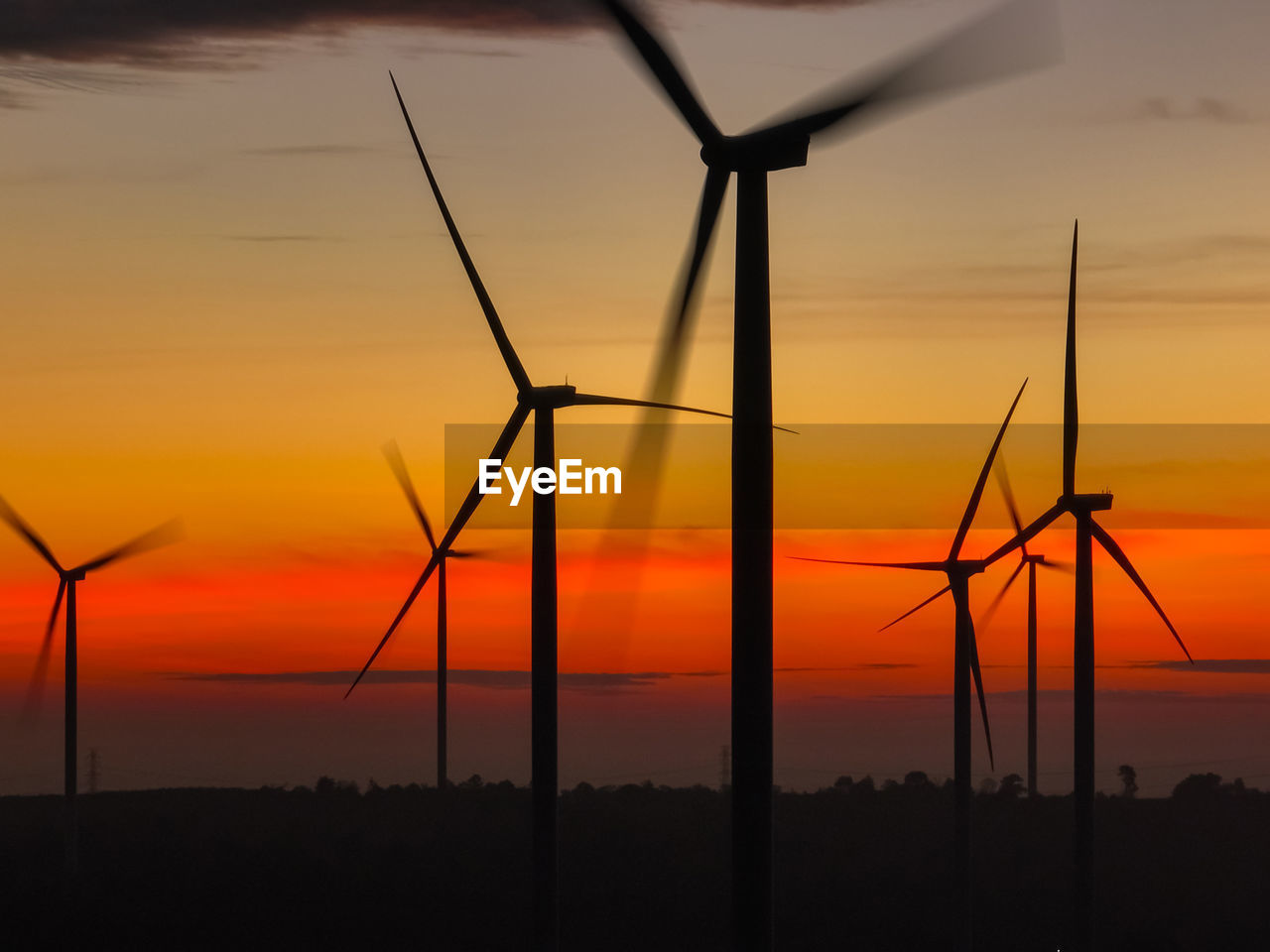 Wind farm landscape against sunset sky. wind energy. wind power. sustainable and renewable energy.