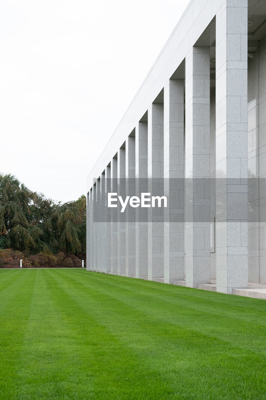 BUILT STRUCTURE ON FIELD AGAINST CLEAR SKY