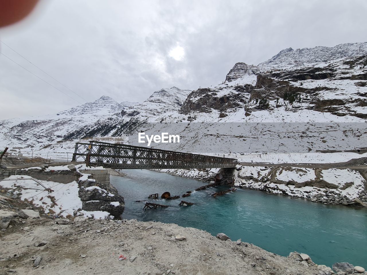 VIEW OF SNOWCAPPED MOUNTAIN AGAINST SKY