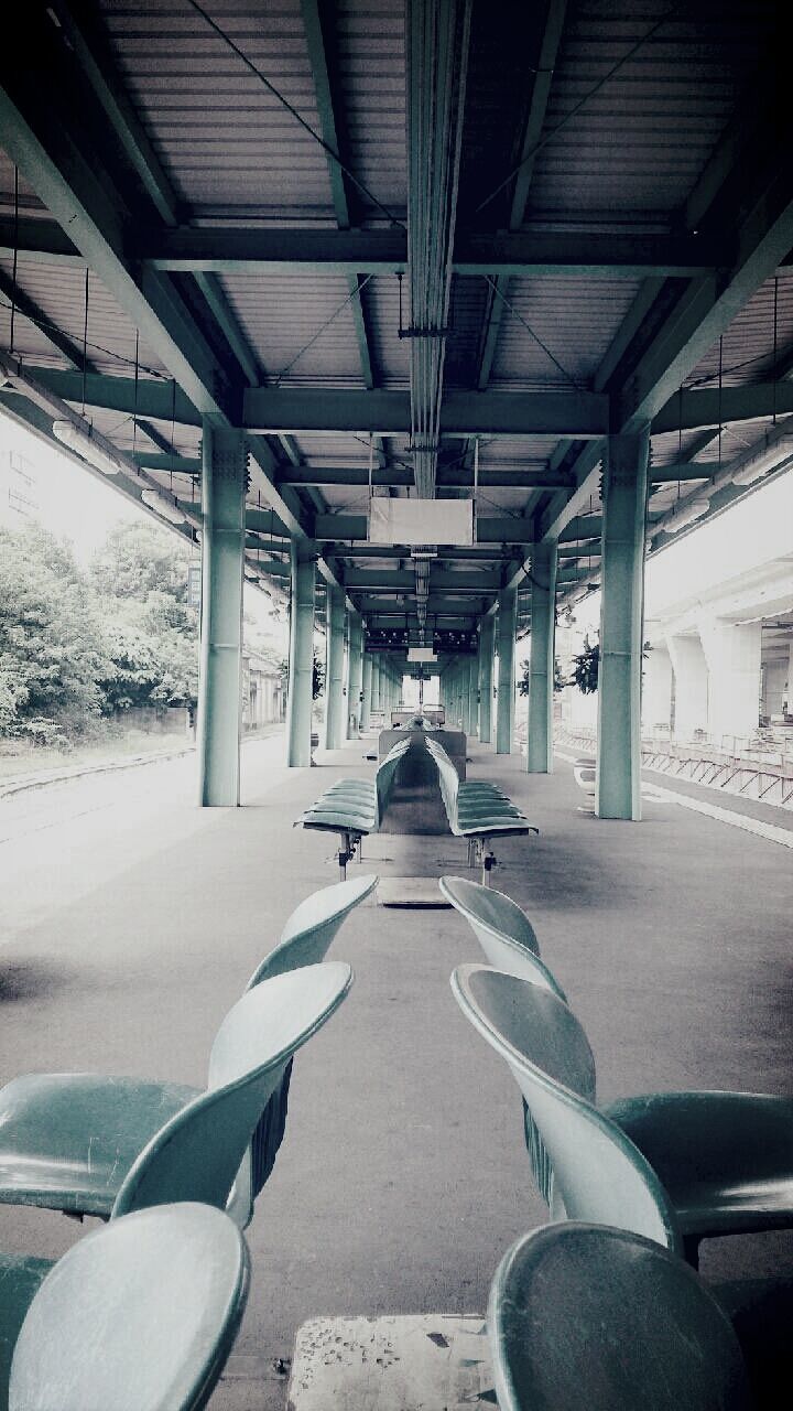 High angle view of seats below bridge