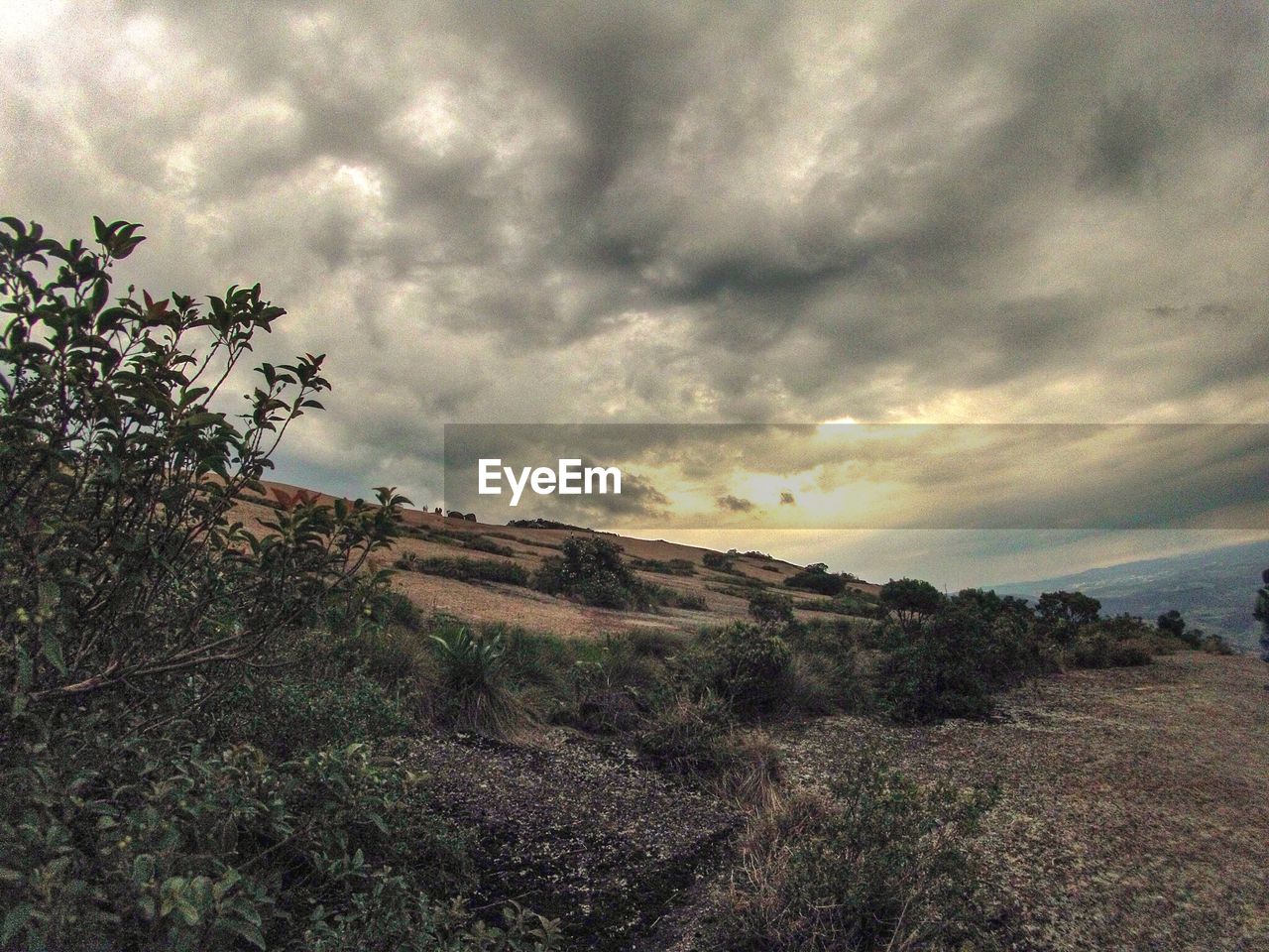 Landscape against cloudy sky