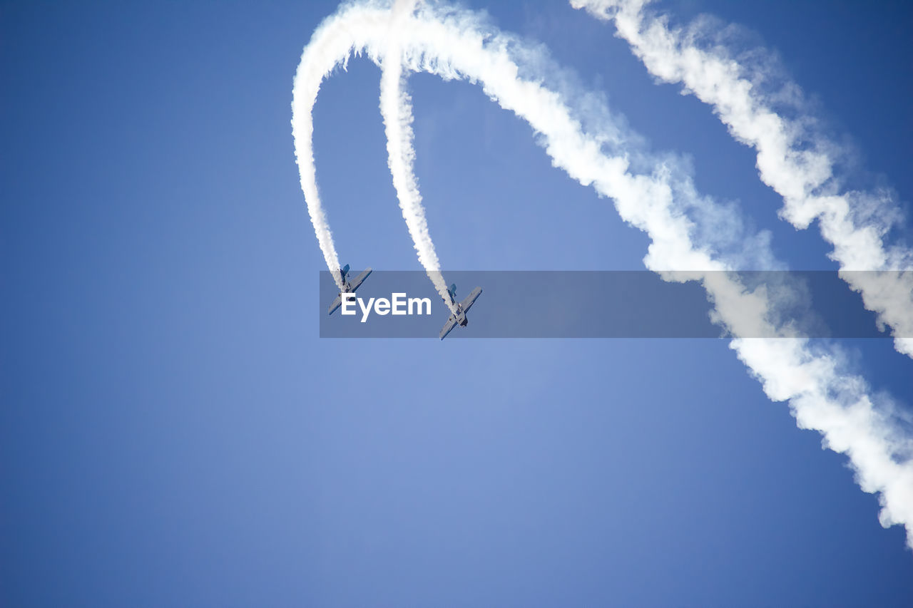 Low angle view of airplane flying in sky