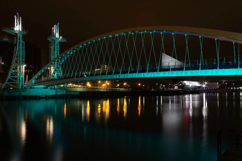 Illuminated salford quays lift bridge at night