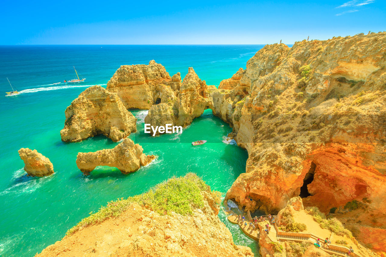 PANORAMIC VIEW OF ROCKS ON BEACH