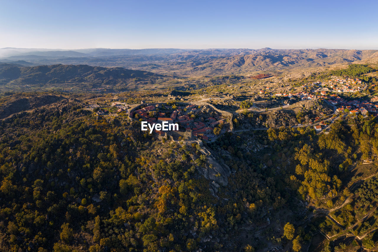 HIGH ANGLE VIEW OF LAND AGAINST SKY