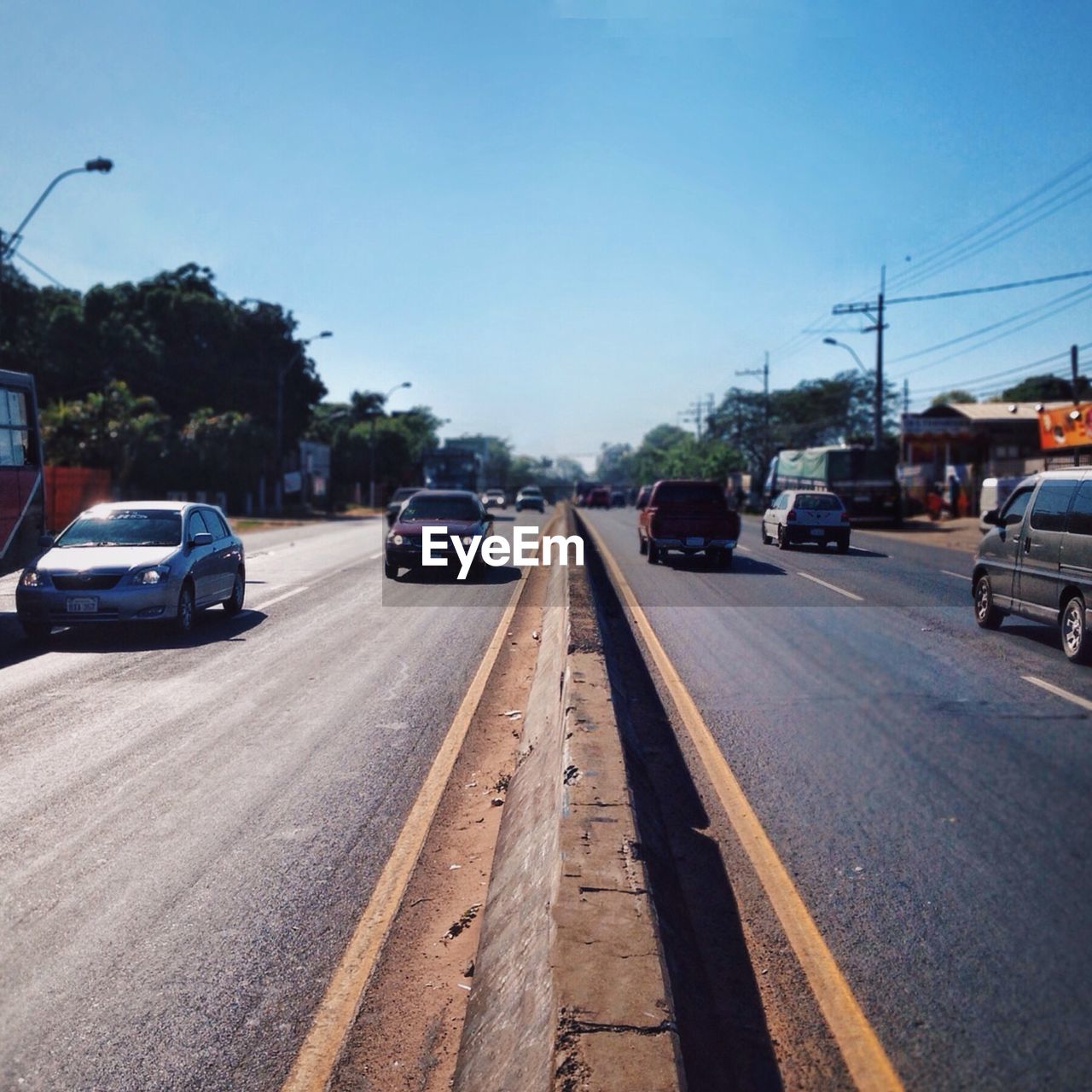 VIEW OF CITY STREET AGAINST CLEAR SKY