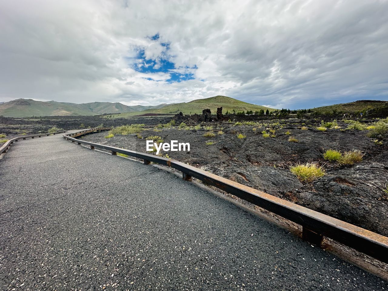 sky, cloud, transportation, environment, landscape, nature, road, horizon, mountain, coast, scenics - nature, track, sea, travel, no people, land, beauty in nature, travel destinations, outdoors, non-urban scene, highway, day, transport, the way forward, rural area, water, mountain range, tranquility, plant, morning