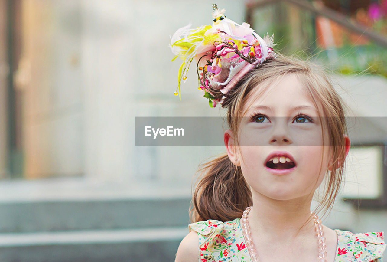 Close-up of cute girl wearing flowers