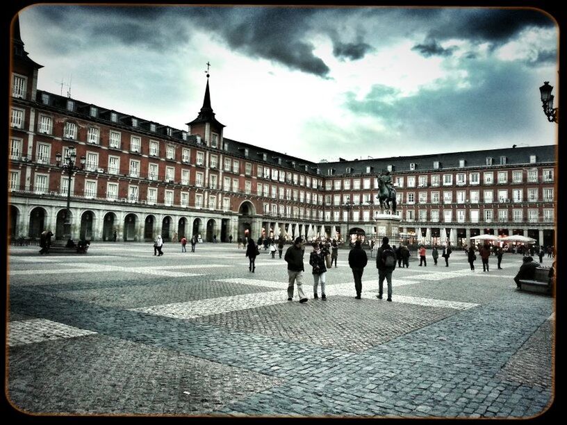 TOURISTS ON CLOUDY SKY