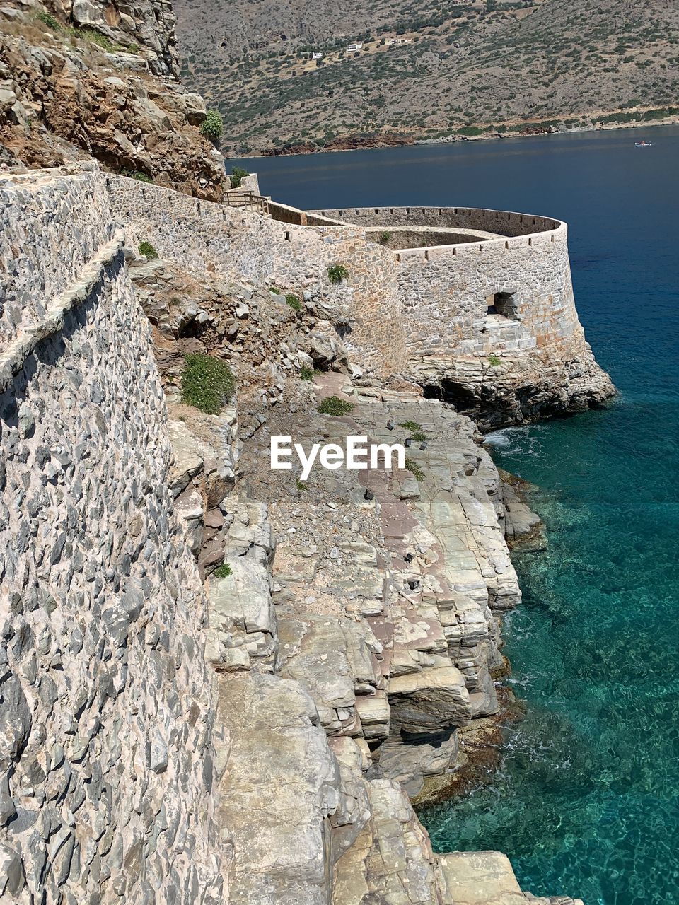 High angle view of rock by sea