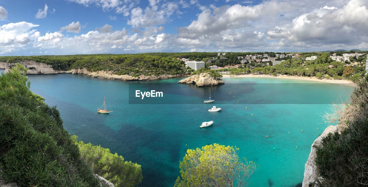 High angle view of boats in sea against sky