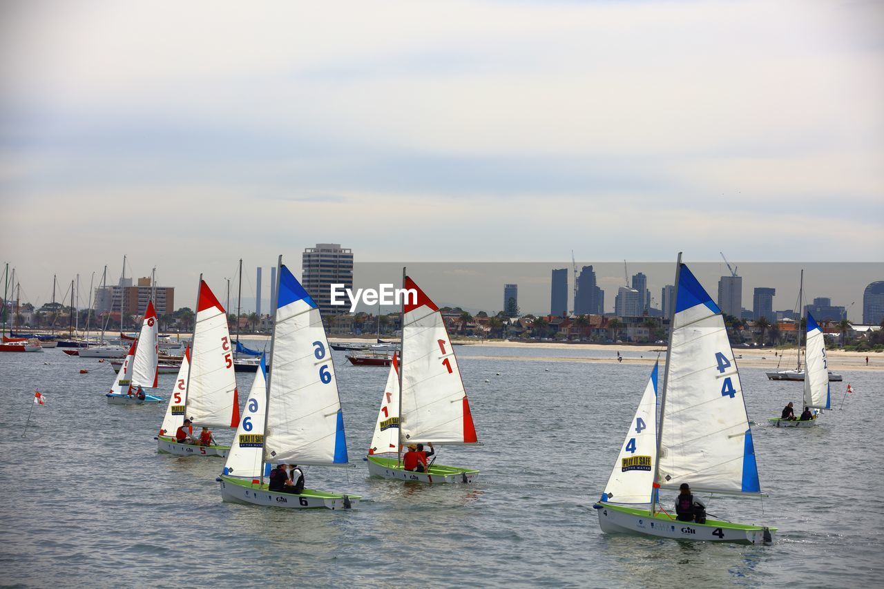 PANORAMIC VIEW OF FLAGS ON SEA AGAINST SKY