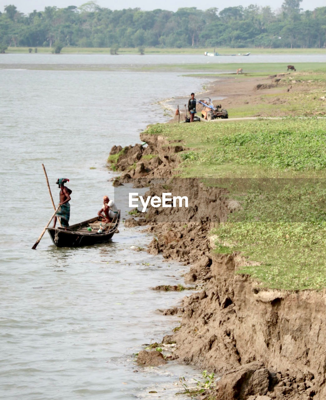 PEOPLE IN BOAT ON RIVER