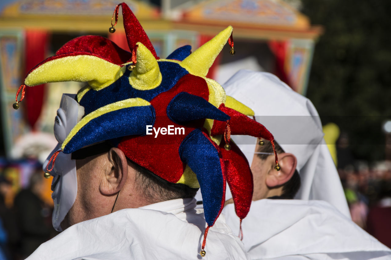 Close-up of men wearing masks at carnival