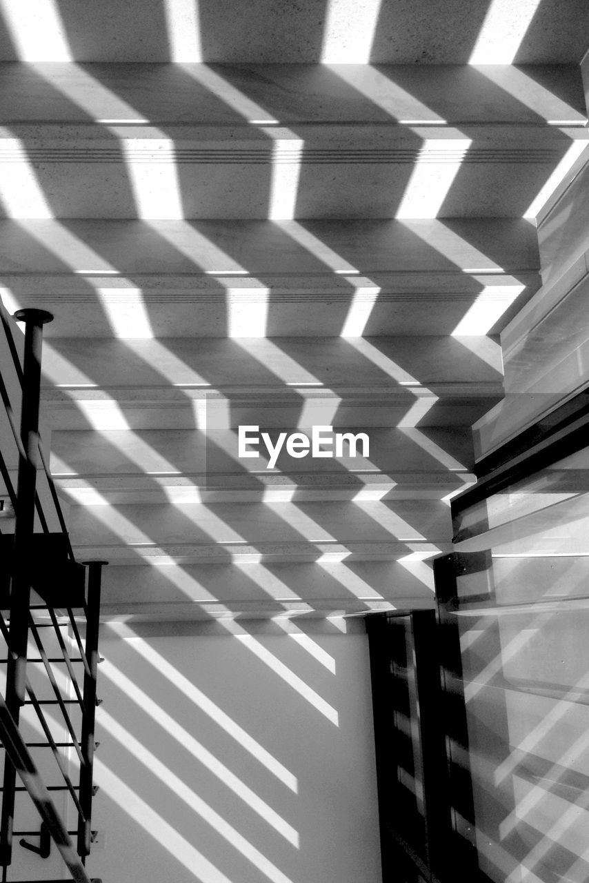 Directly above shot of shadow and sunlight falling on steps