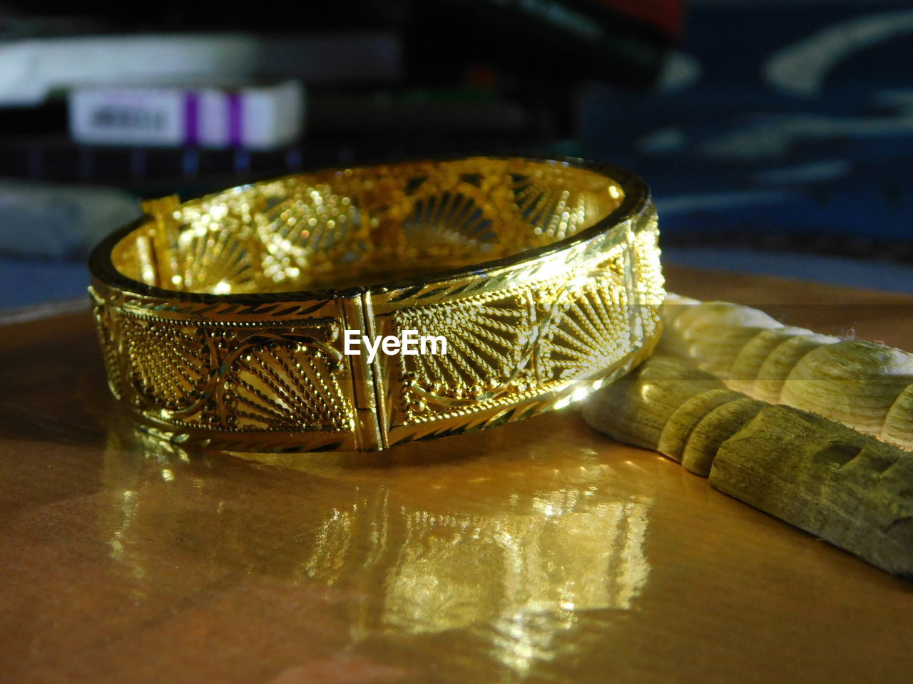 Close-up of gold jewelry on table