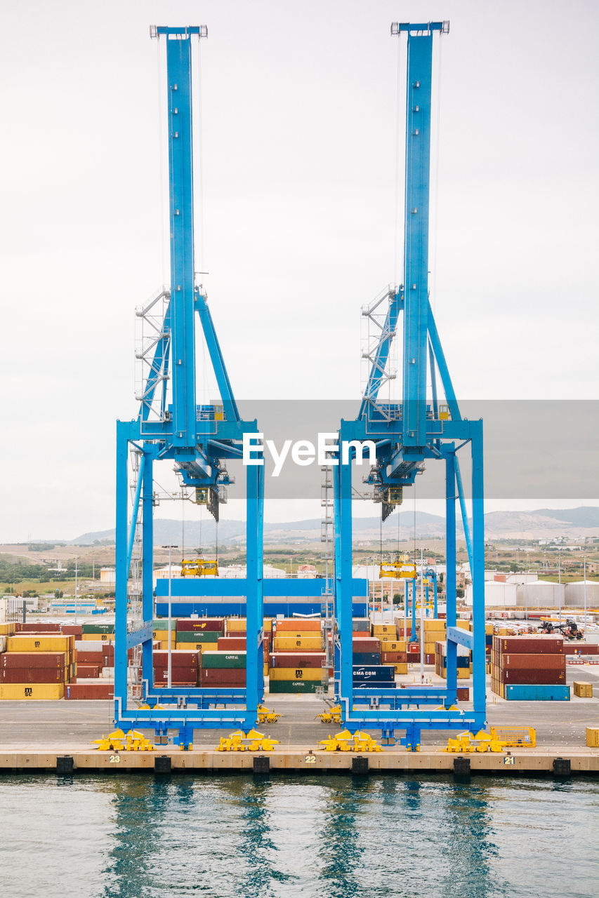 Containers against clear sky at the port