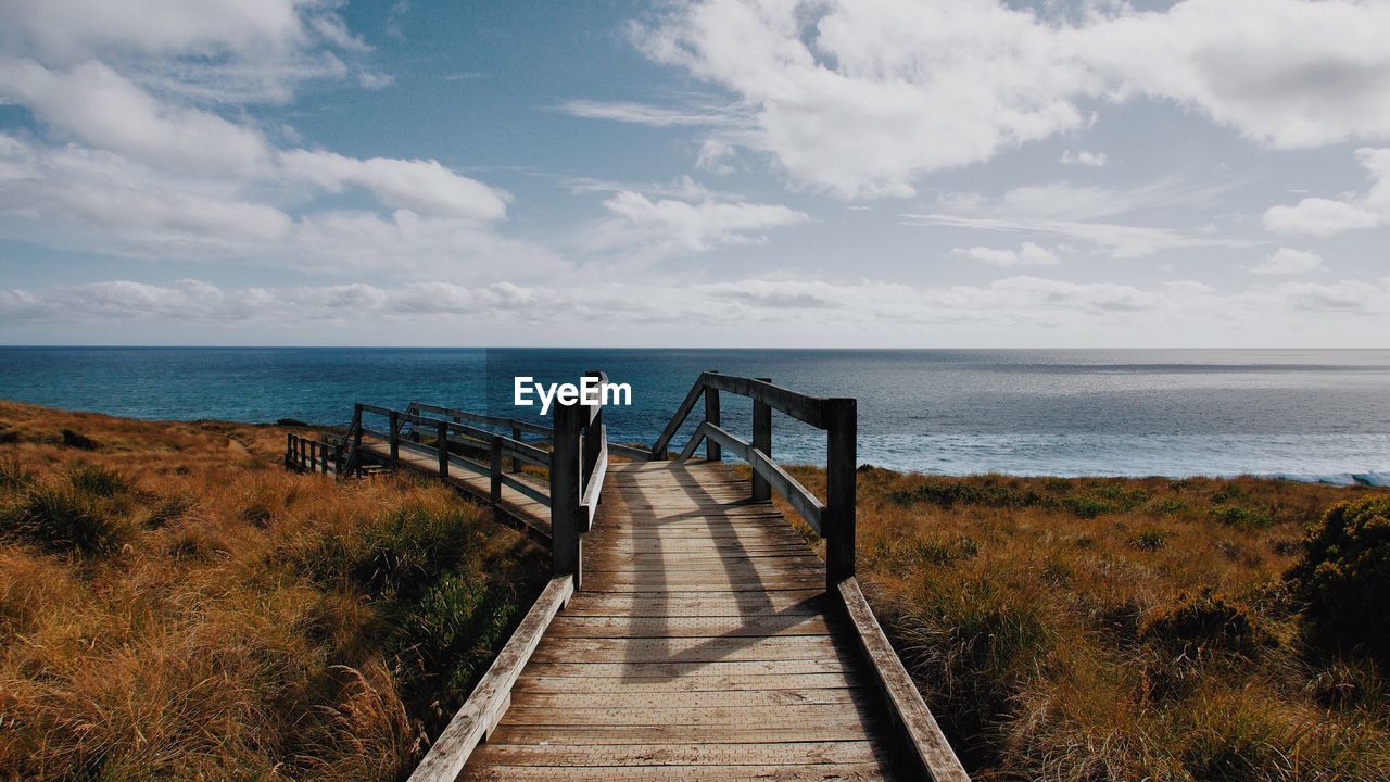 Pier over sea against sky