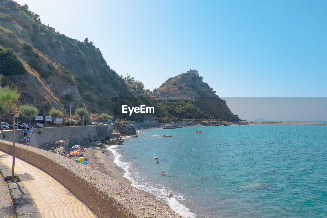 SCENIC VIEW OF BEACH AGAINST CLEAR SKY