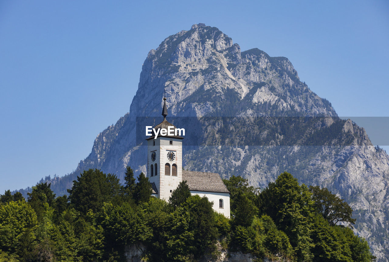 Austria, upper austria, traunstein, johannesbergkapelle with mountain in background