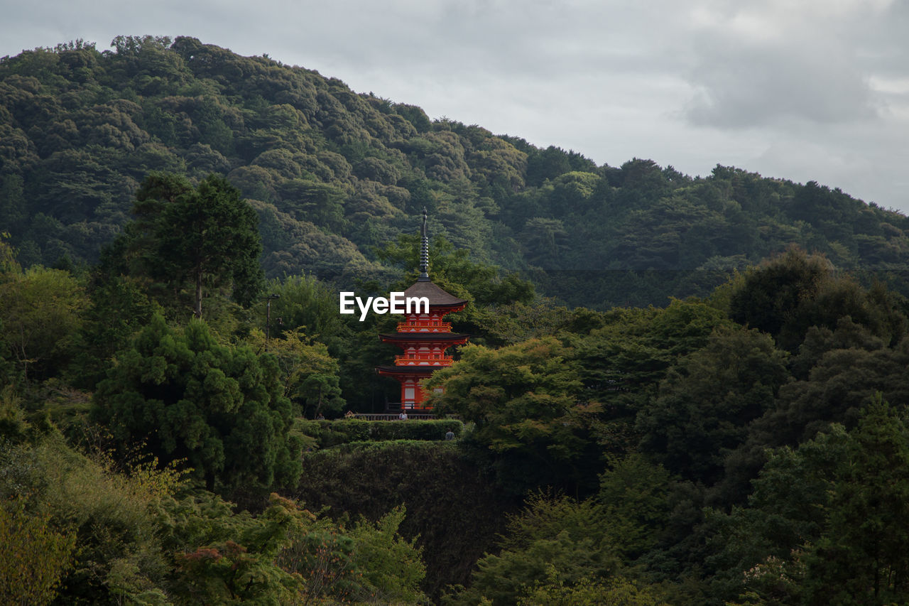 High angle view of trees japanese temple and mountains against sky