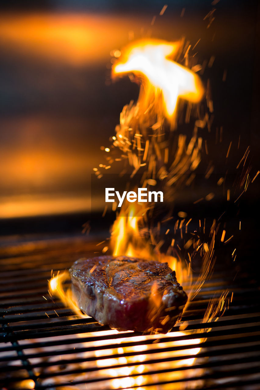 Beautiful grilled steak with sparks of fire