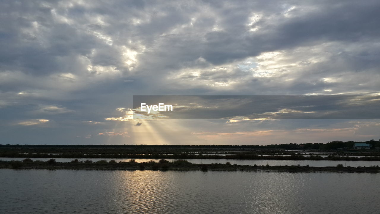 Scenic view of river against sky at night