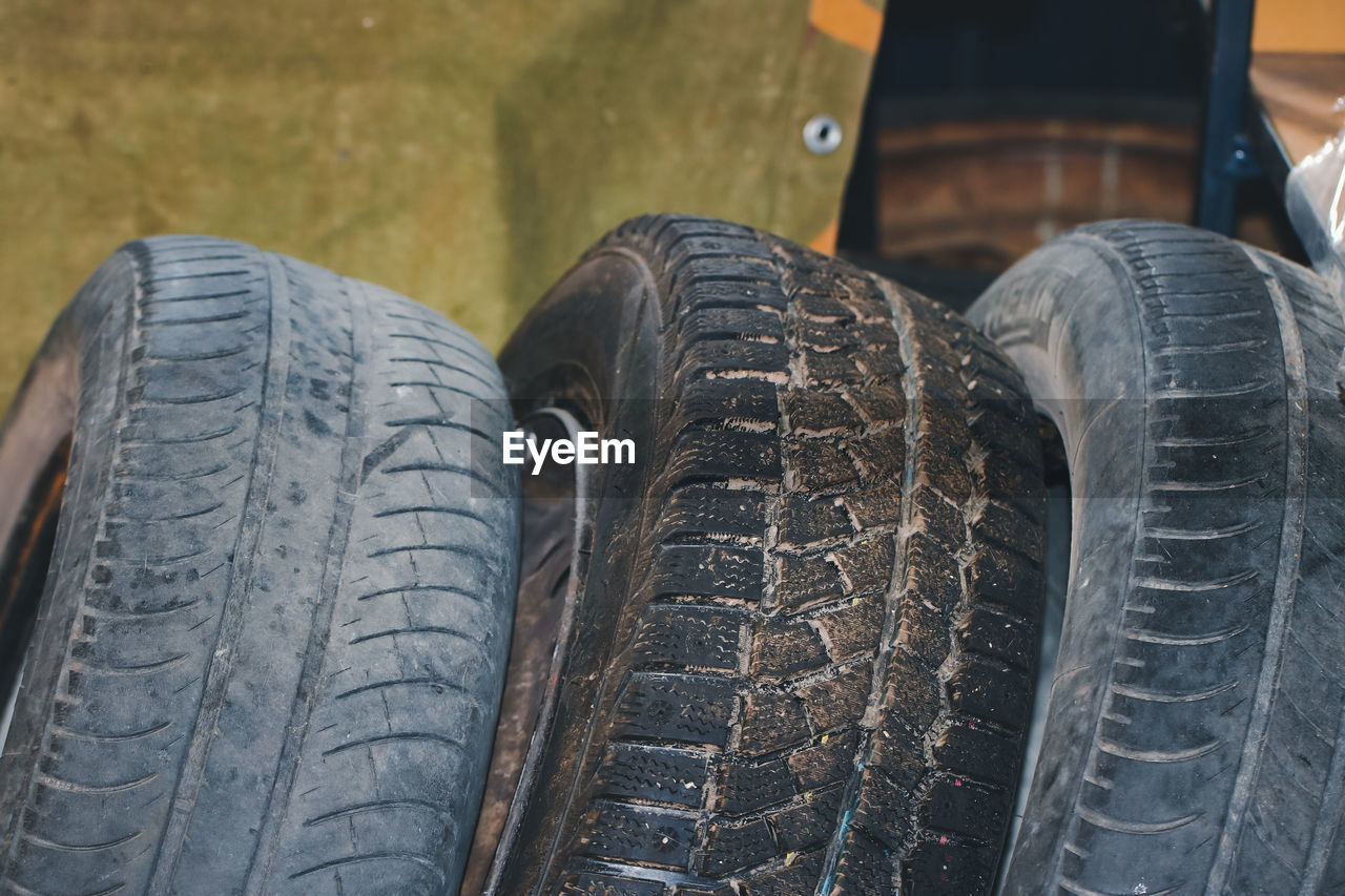 Three auto tires in a row