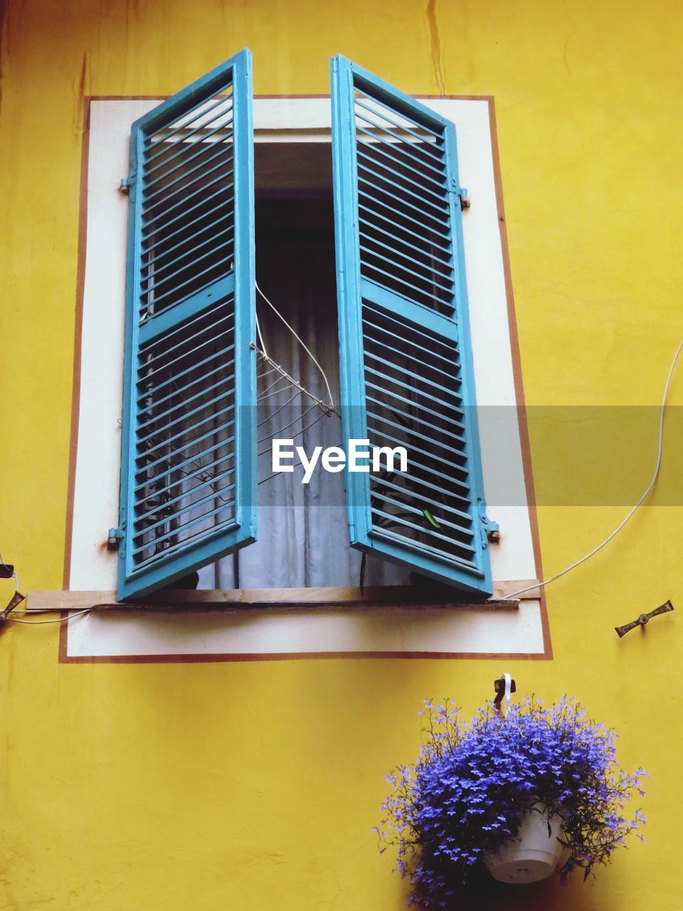 Open window shutter of house